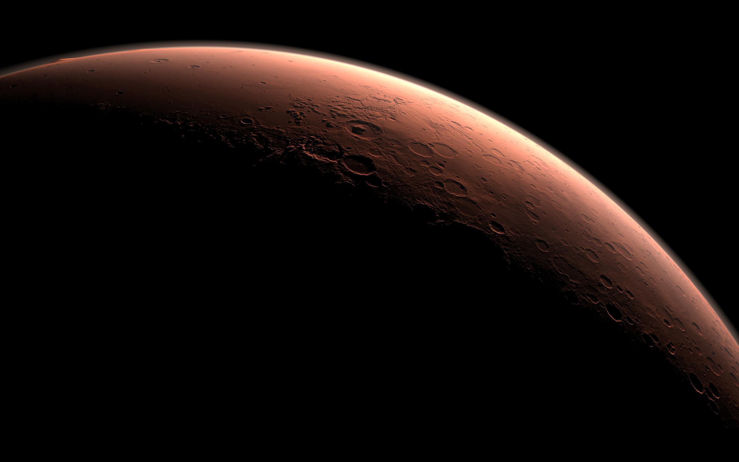 3D rendering of Mars with daylight peeking over Gale Crater
